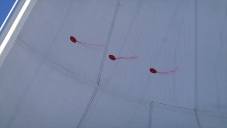 close up of the wind indicators on the sail of a sailboat