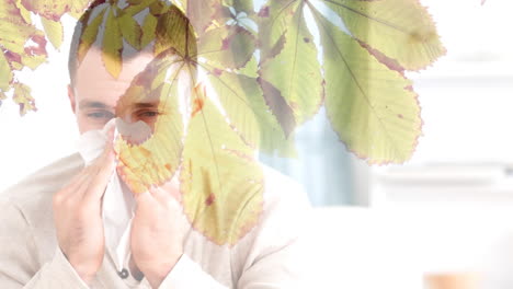 hojas de otoño que caen y el hombre estornudando mientras sufre de alergia 4k