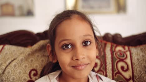 portrait of an indian child at home during coronavirus lockdown