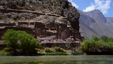 Static-shot-of-rocky-cliff-in-the-Vilcanota-river-located-in-Pichingoto,-Sacred-Valley---Cuzco,-Peru