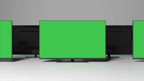 multiple televisions with green screens