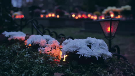 Flowers-and-burning-candles-on-a-grave