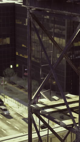 urban landscape showing industrial structure and city street at sunset
