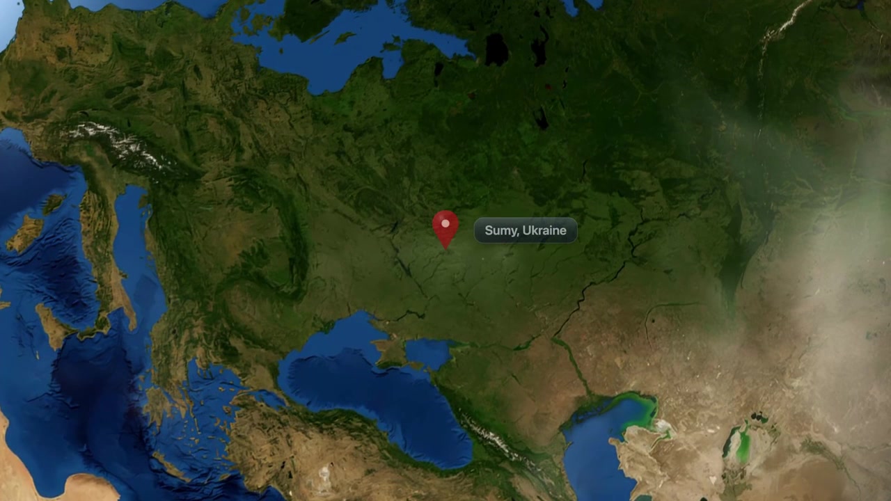 Satellite animation zooms from deep space into planet Earth, pinpointing Sumy, Ukraine. Includes NASA public domain imagery.