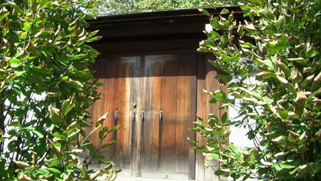 hinoki wood gate at entrance of a japanese garden