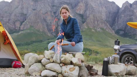 caucasian woman eating in nature