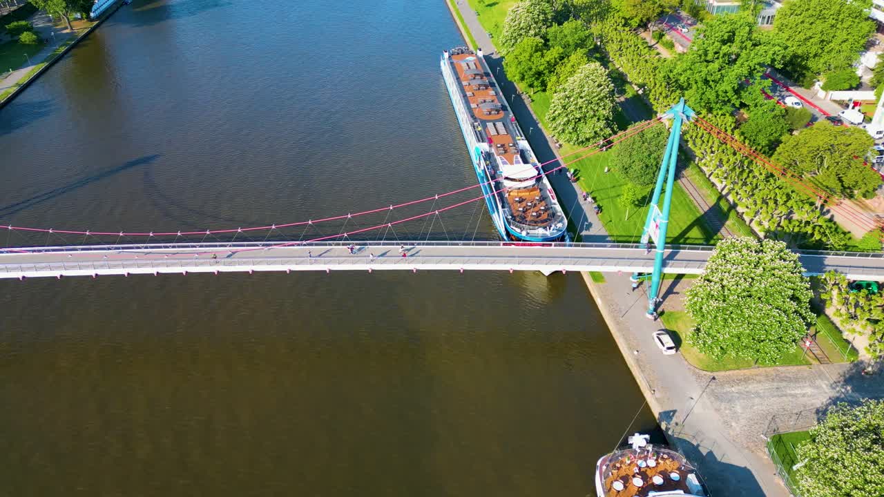4K Aerial Drone Video of the Holbeinsteg Pedestrian Bridge over the Main River in Downtown Frankfurt, Germany