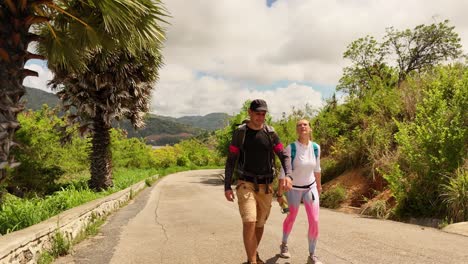 couple hiking on a mountain road