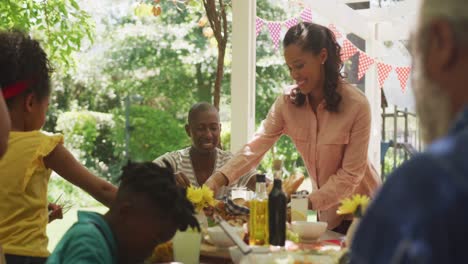 multi-generation african american family spending time in garden together