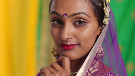 Close-Up-Portrait-Of-Female-Kathak-Dancer-Performing-Dance-Wearing-Traditional-Indian-Dress-And-Jewellery-Looking-At-Camera-3