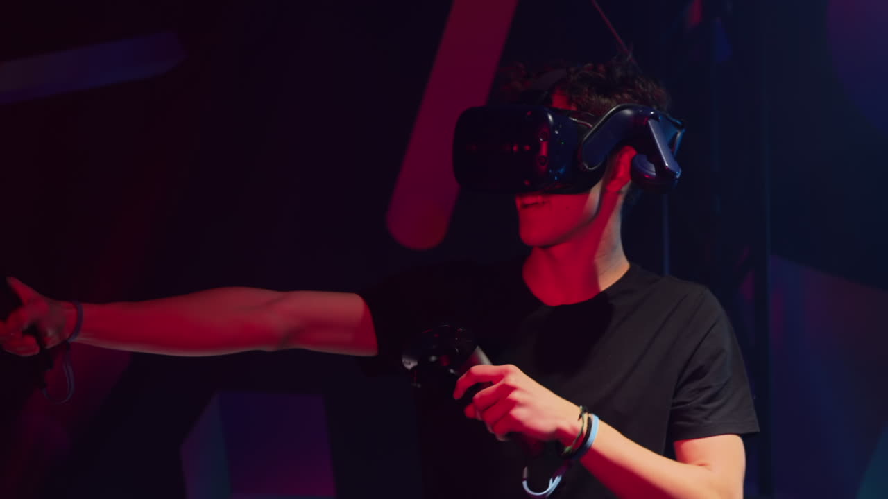 Boy playing with a Virtual Reality headset in a studio