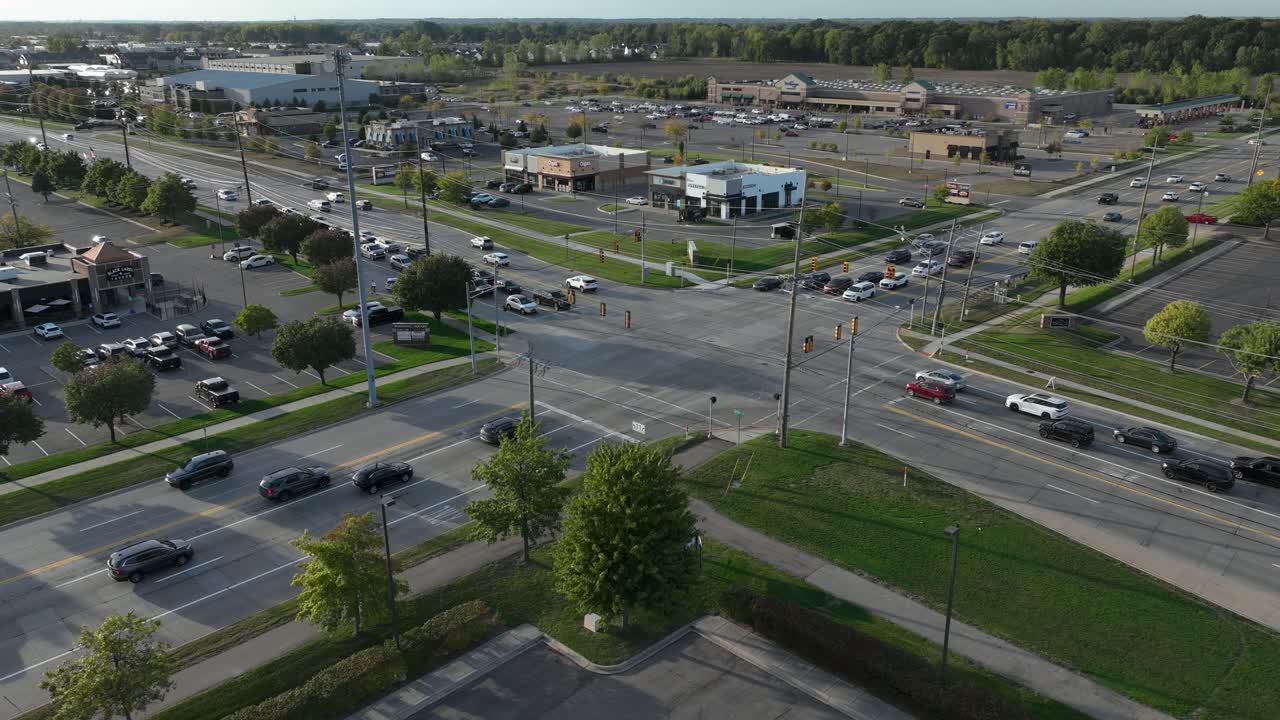 Drone time lapse of evening traffic at the corner of 23 Mile Road and Hayes Road in Shelby Township Michigan