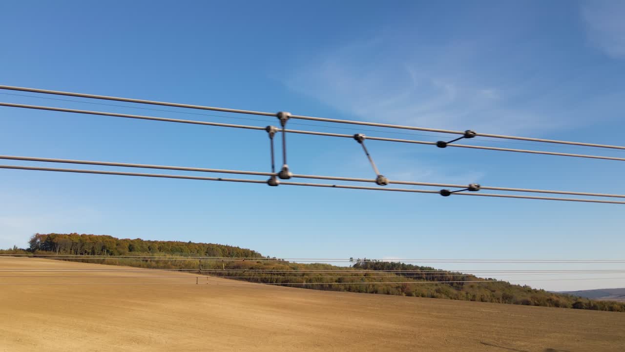 High voltage tower with electric power lines divided by safe guard bushing transfening safely electrical energy through cable wires. Electricity transmission on long distance concept