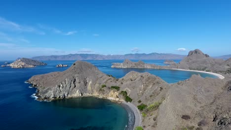 Aerial-view-of-the-Padar-island,-sunny-day,-in-Komodo-National-Park,-Labuan-Bajo,-Indonesia---rising,-drone-shot