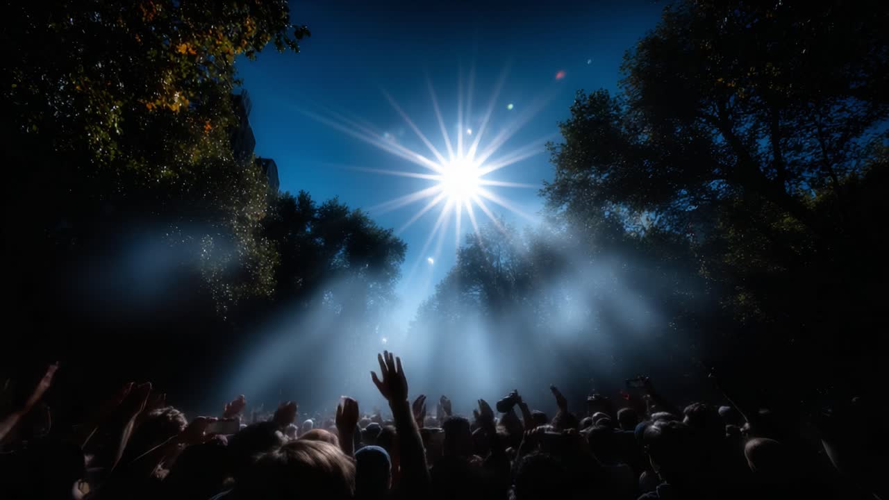 A Vibrant Crowd Celebrates Under a Brilliant Sun, Surrounded by Beams of Light and Lush Greenery, Capturing the Essence of Joyful Togetherness and Nature's Beauty