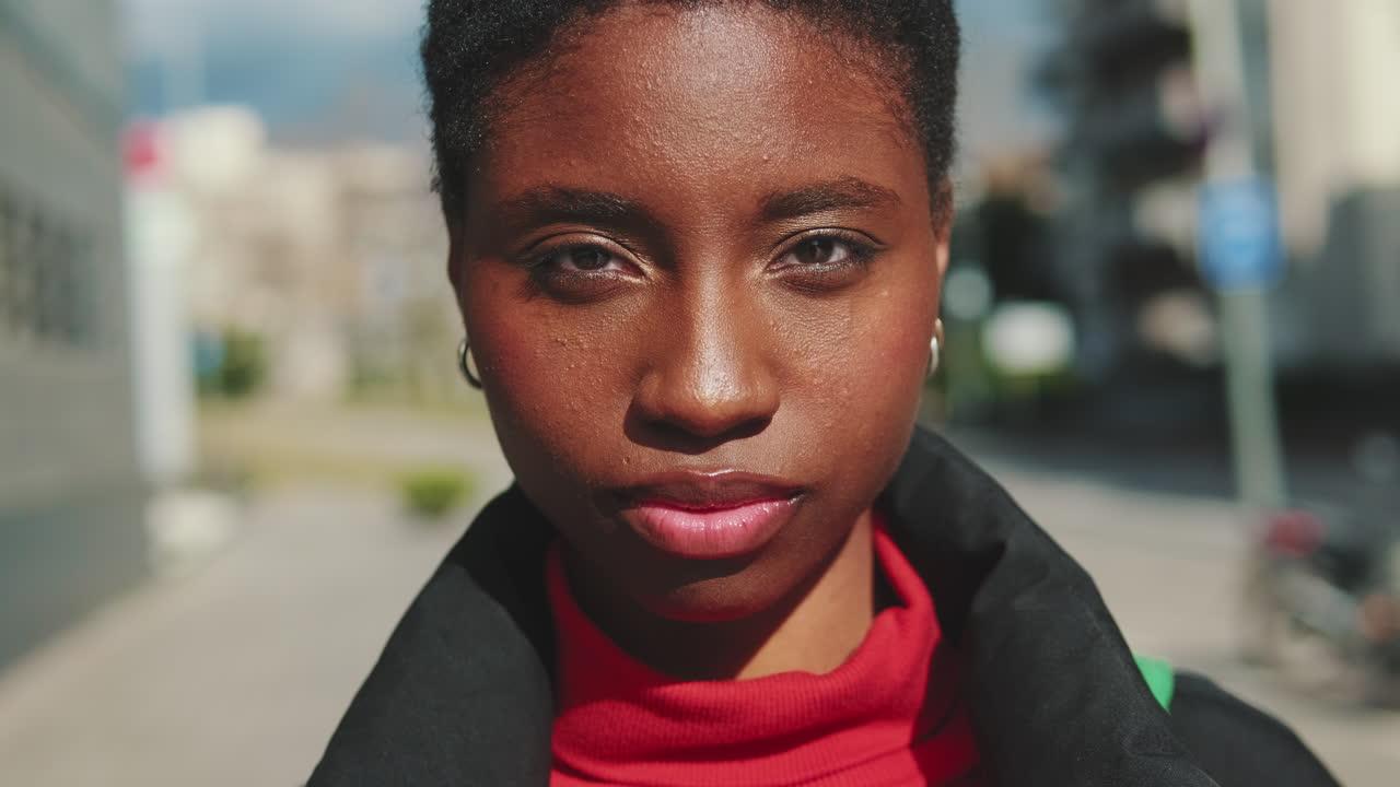 Close-up Portrait of a Young African American Woman Looking at Camera