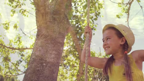 Niña-Jugando-En-Un-Columpio-Colgado-De-Un-árbol.-Montaje-Sobre-árboles-Iluminados-Por-El-Sol