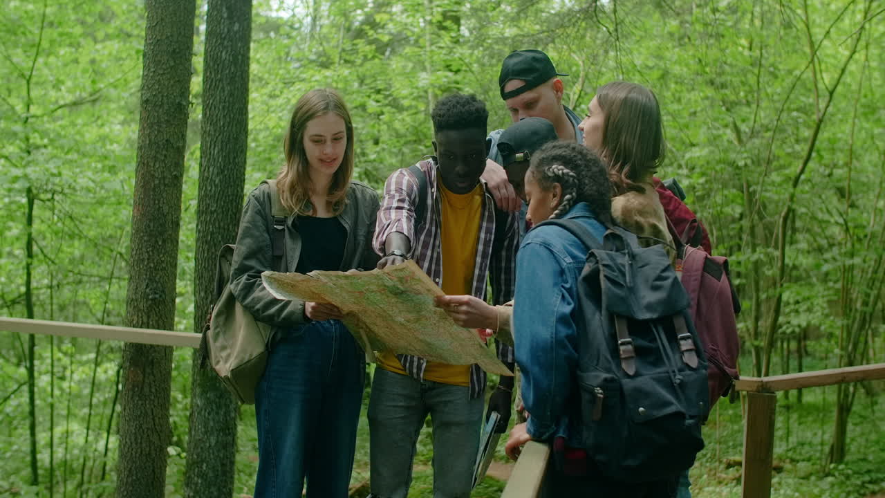 Friends Exploring the Forest with a Map