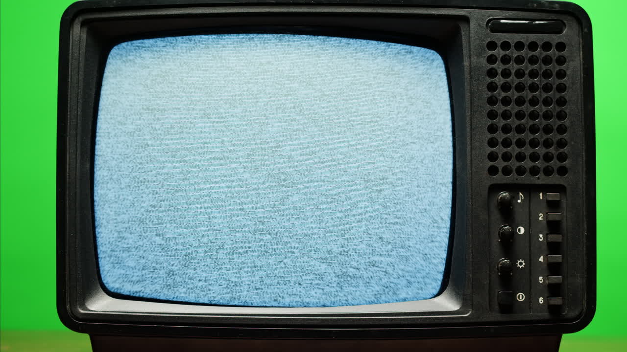 Retro Style TV Set with Green Screen chroma key background, vintage 60s analog television with grain and noise.