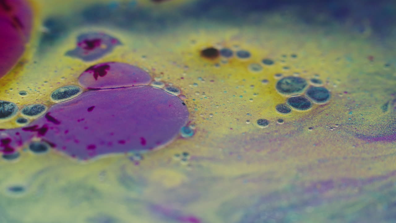Colourful, organic, liquids macro shots buzzing and flowing