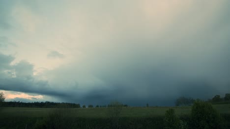 summer storm clouds approaching in evening dusk with rain