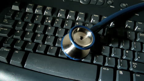 Stethoscope-falling-onto-computer-keyboard