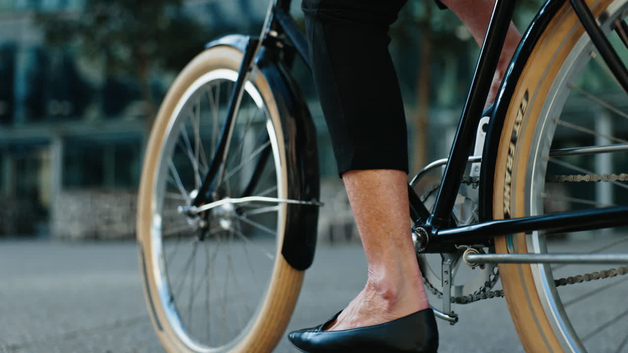 Cycling, woman and feet on bike for travel