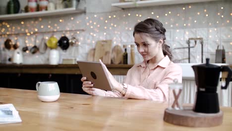 woman using tablet in the kitchen