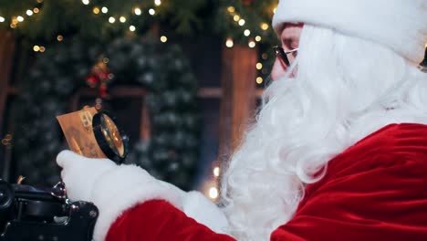santa claus is trying to read a letter through a magnifying glass