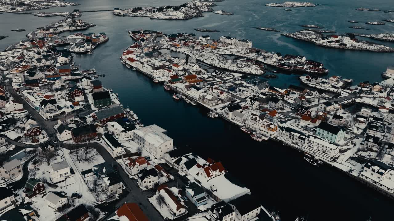 Henningsvaer Residential Houses And Bay In Winter In Norway. - aerial shot