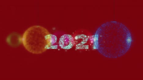 animation of 2021 text over christmas decoration on red background