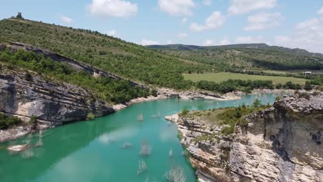 congost de mont rebei canyon at ager, catalonia and aragon, spain - aerial drone view of the blue emerald noguera ribagorçana river, rocky mountains and green valley