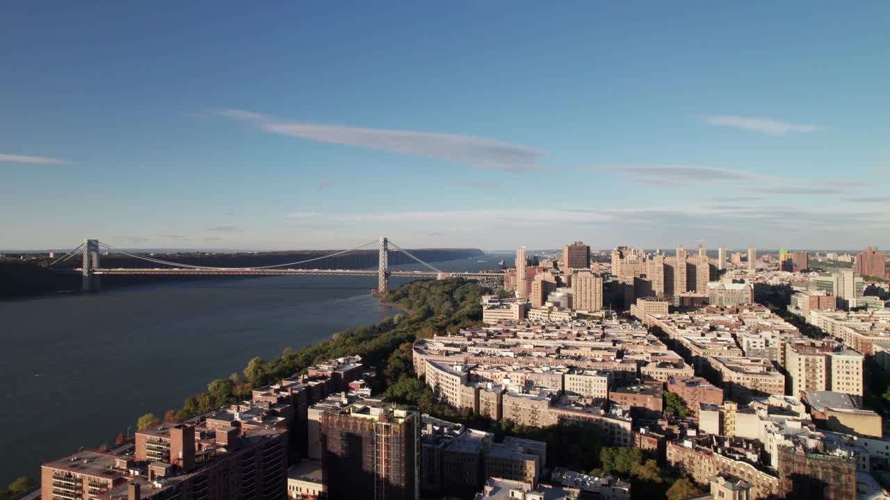 Beautiful aerial of uptown New York City with George Washington Bridge. Harlem and Washington Heights, 4K
