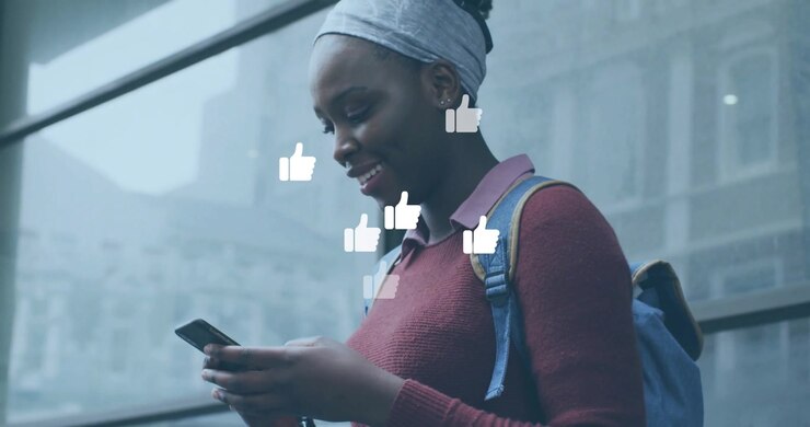 Student tapping phone at glass wall creating orbiting like icons indicating social media engagement