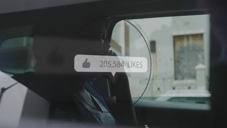 animation of social media like notification over african american woman using smartphone in car