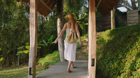 travel woman arriving at tropical hotel resort on vacation 4k