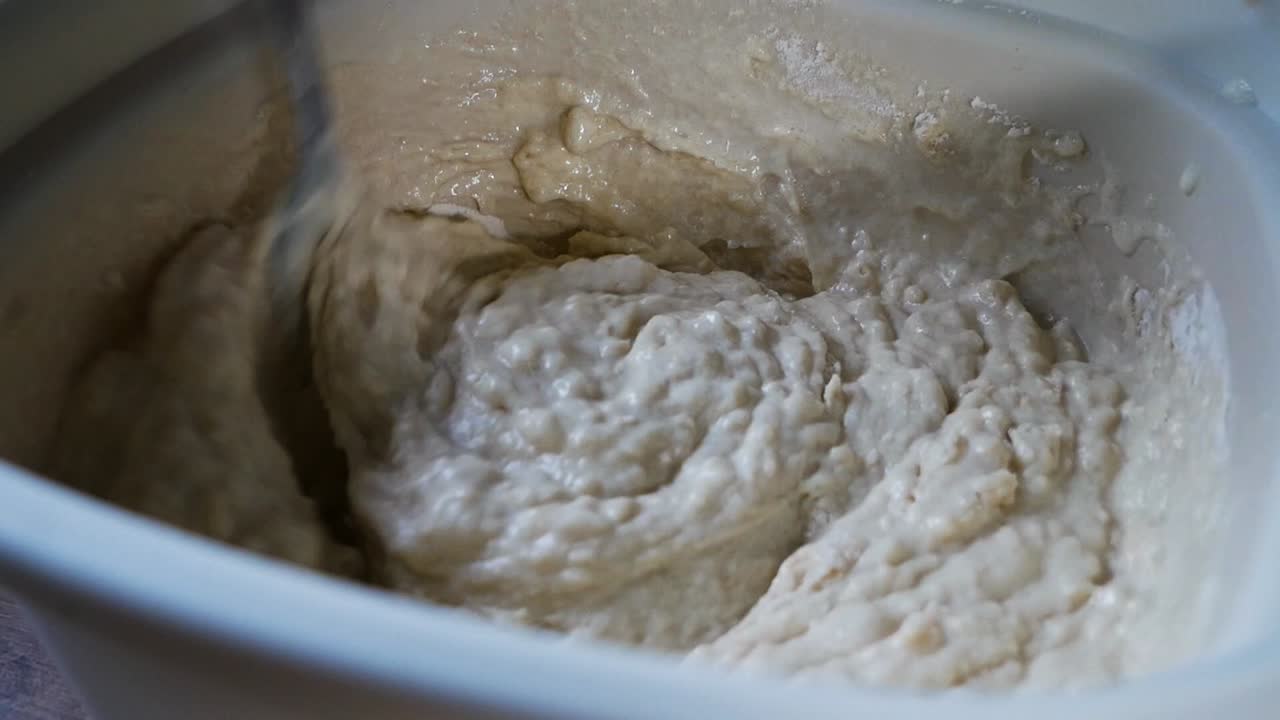 Mixing batter for american pancakes in close up homemade shot