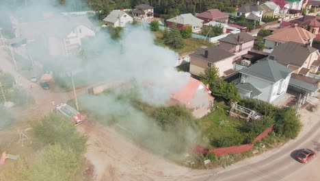 house fire in suburban area with fire truck