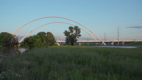 4K---The-Margaret-McDermott-Bridge-is-seen-in-the-distance-as-traffic-drives-by