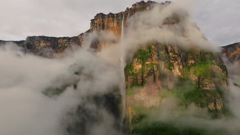 majestic angel falls with fog clouds at sunrise in canaima national park, gran sabana, venezuela