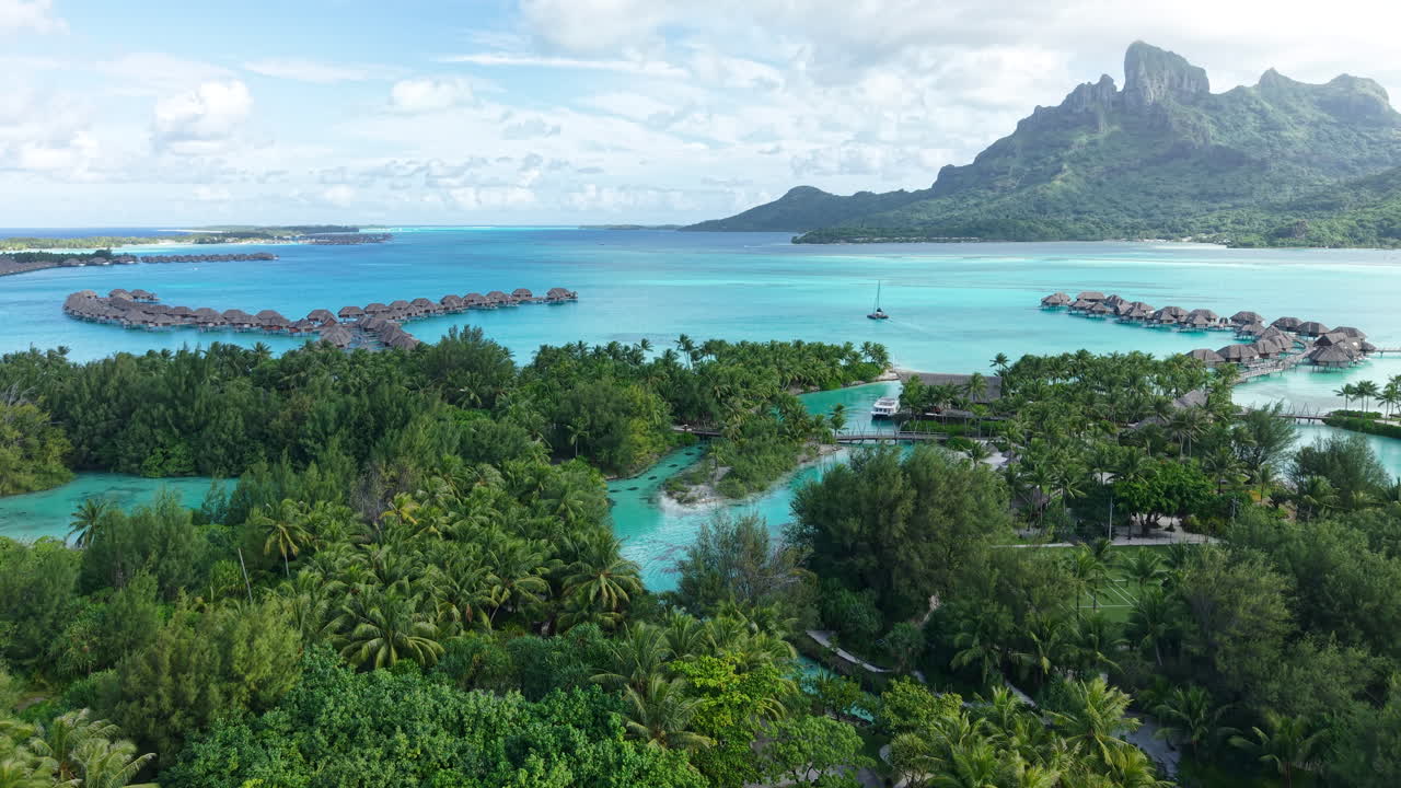 Bora Bora Island, French Polynesia. Revealing Drone Shot of Luxury Tropical Resort and Lagoon