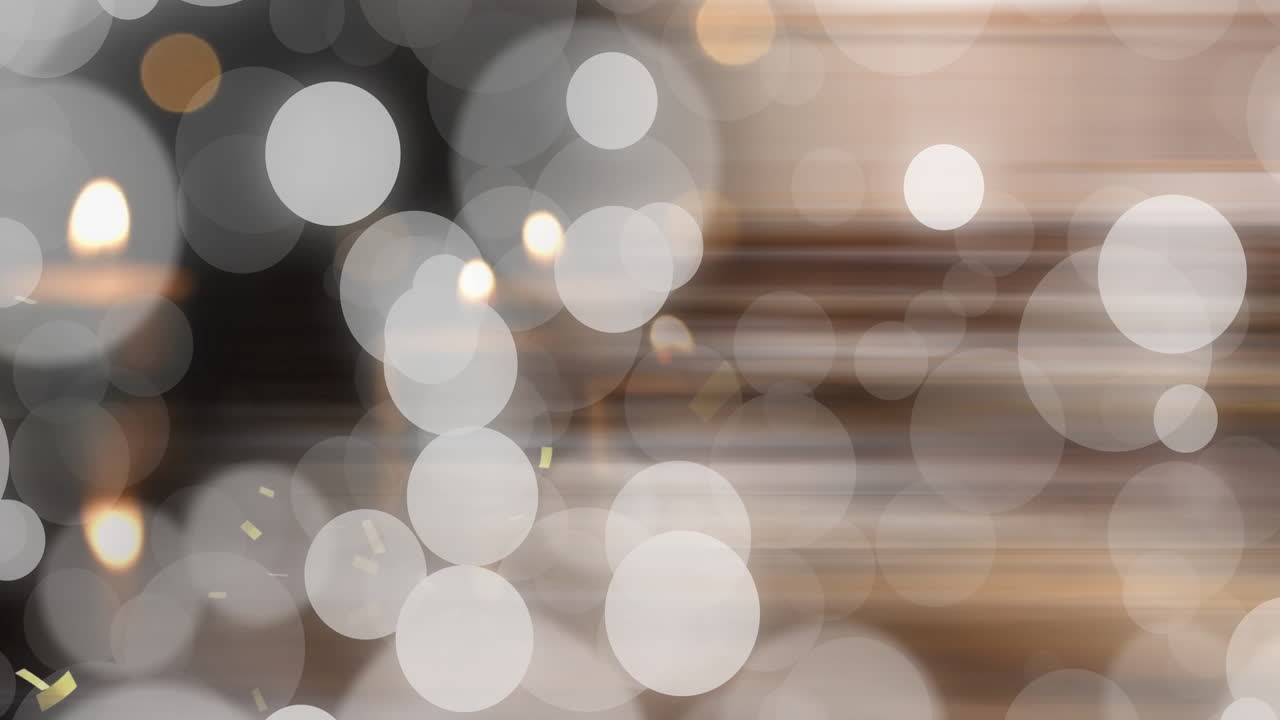 Animation of light spots and confetti on blurred background