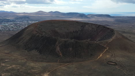 zoom-out aerial view of the volcano calderon hondo in fuerteventura spain