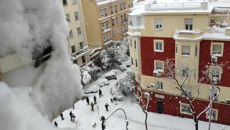 madrid's street full of snow seen from a window