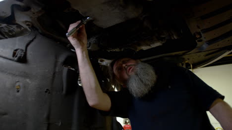 auto mechanic working with car at the garage