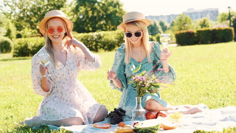 two friends enjoying a picnic in the park