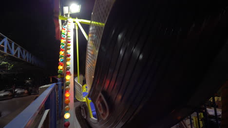 Boy-enjoying-pirate-boat-ride-at-fun-fair