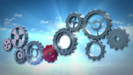 cogs and wheels turning against blue sky