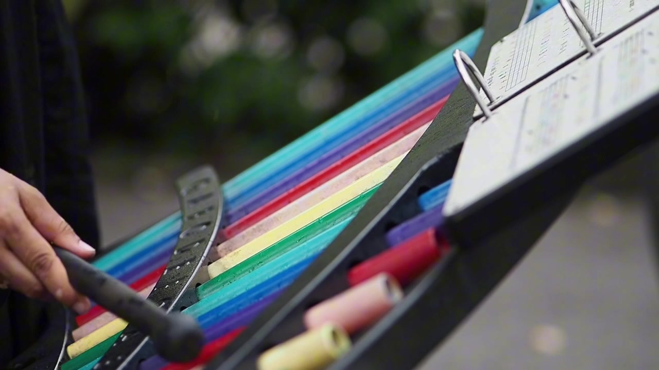 Musician Playing Colorful Xylophone Outdoors