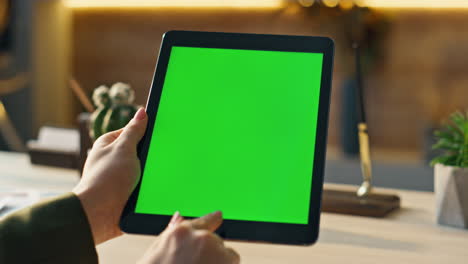 mockup tablet worker scrolling display browsing social media at office close up.